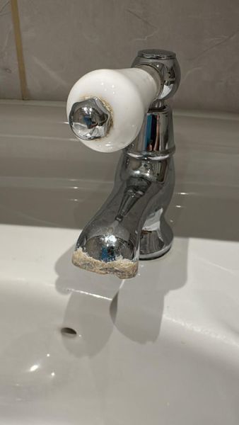 Bathroom taps before cleaning