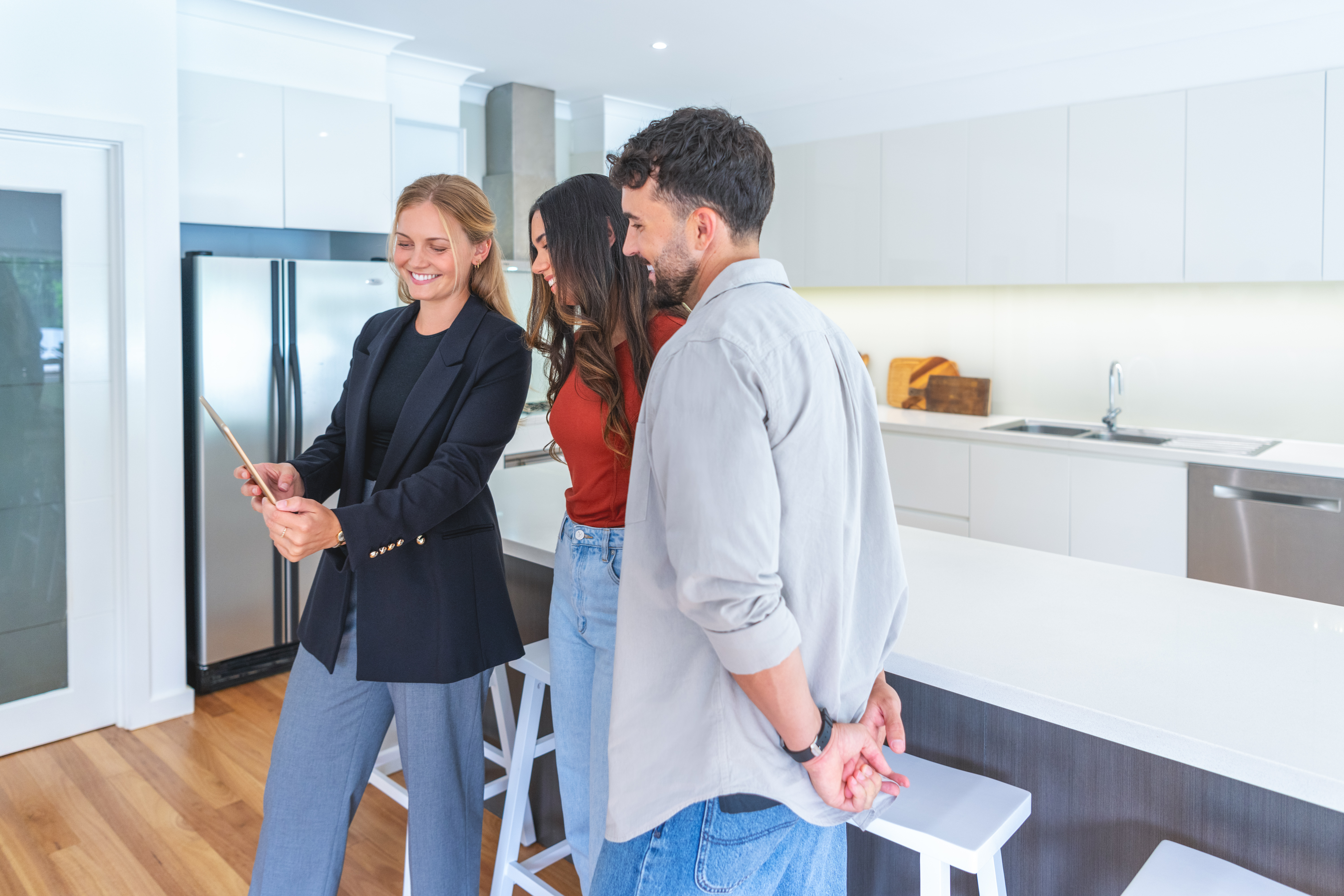 A Lynch agent showing clients around a London rental property